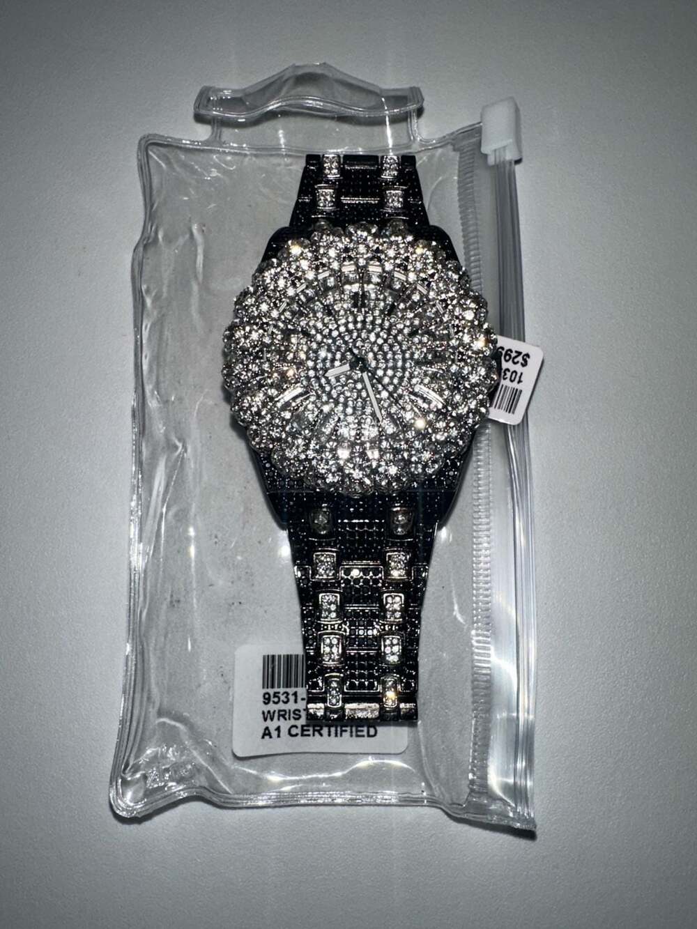 Black metal iced out wrist watch